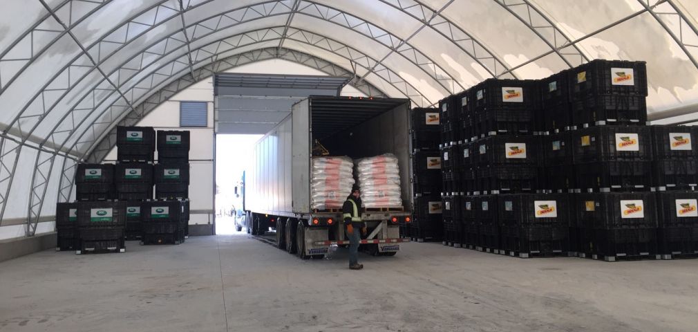 Inside TCO Agromart warehouse with delivery truck