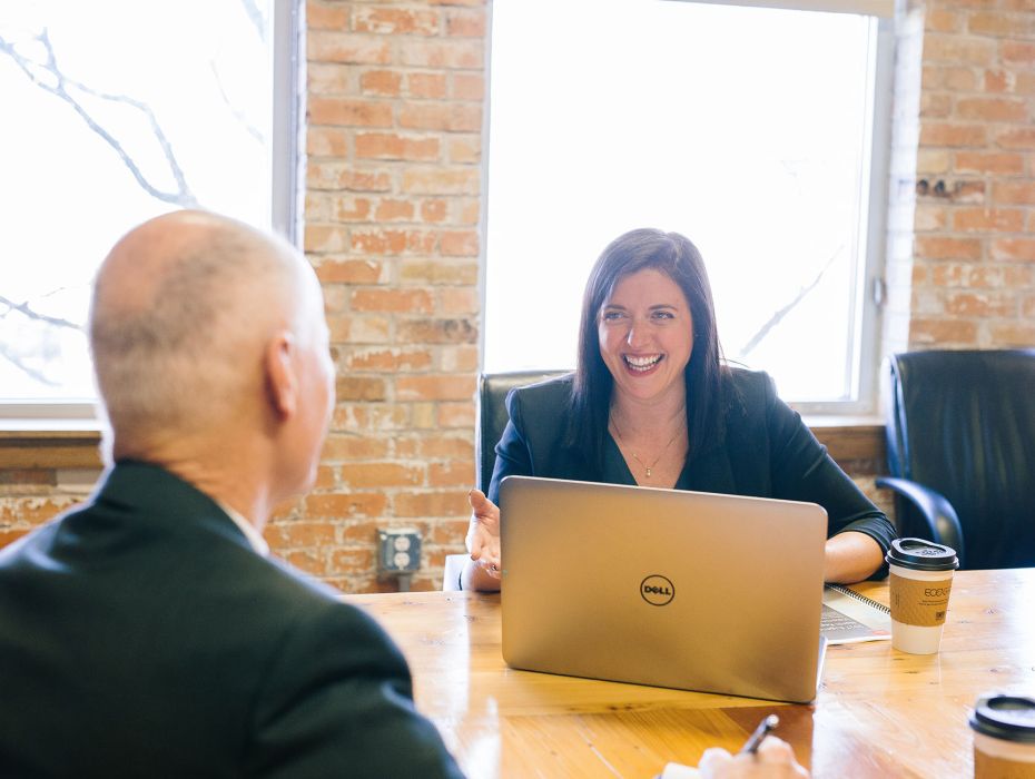 Photo of financial meeting with client at desk